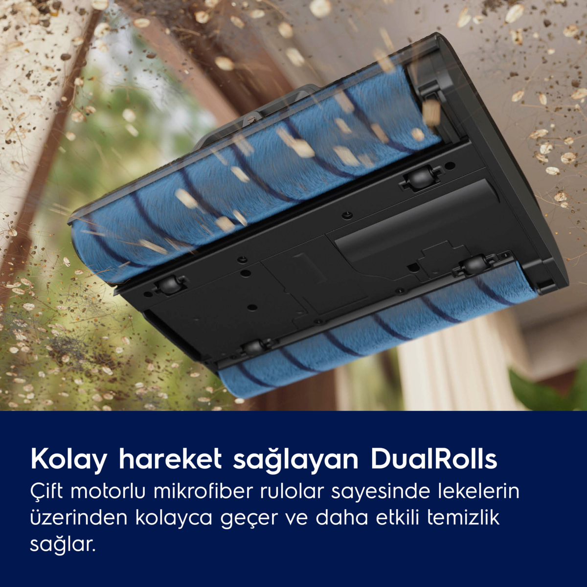 Çift silindirli, enkaz temizleyen mavi elektrik süpürgesi başlığının yakın çekimi.