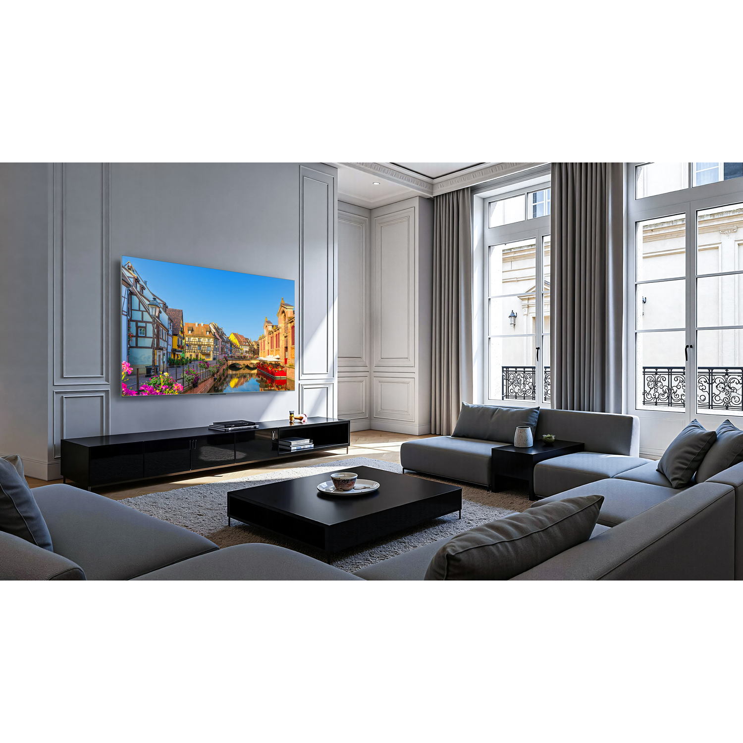 Un salon spacieux avec une télévision grand écran affichant une image colorée.