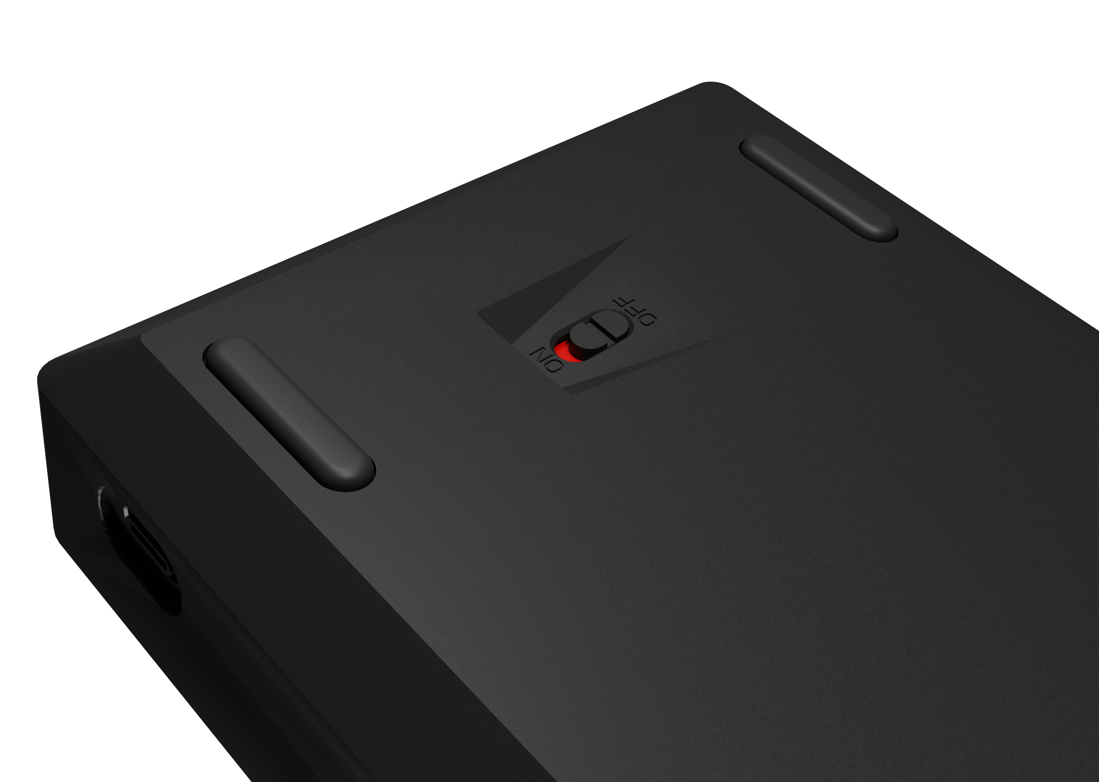 Zbliżenie włącznika/wyłącznika na spodzie czarnej klawiatury. Czarne tło.