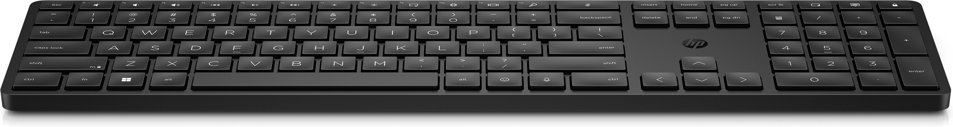 Eine schwarze Computertastatur. Die Tasten sind schwarz und die Buchstaben weiß. Es ist eine Standardtastatur.