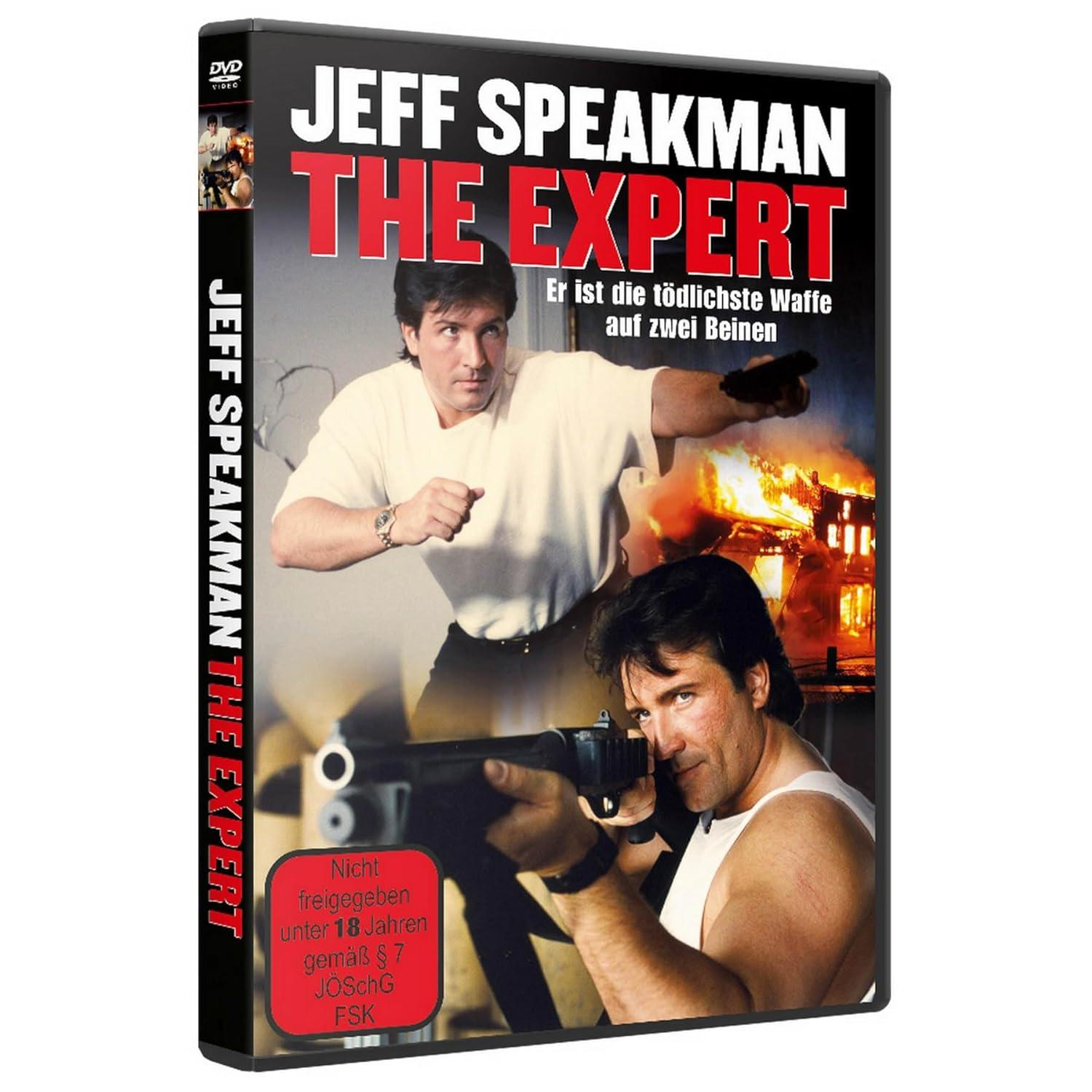 DVD-Hülle mit zwei Männern auf dem Cover. Der Text lautet 'The Expert'. Ein Mann zielt mit einer Waffe, und es gibt ein Feuer.