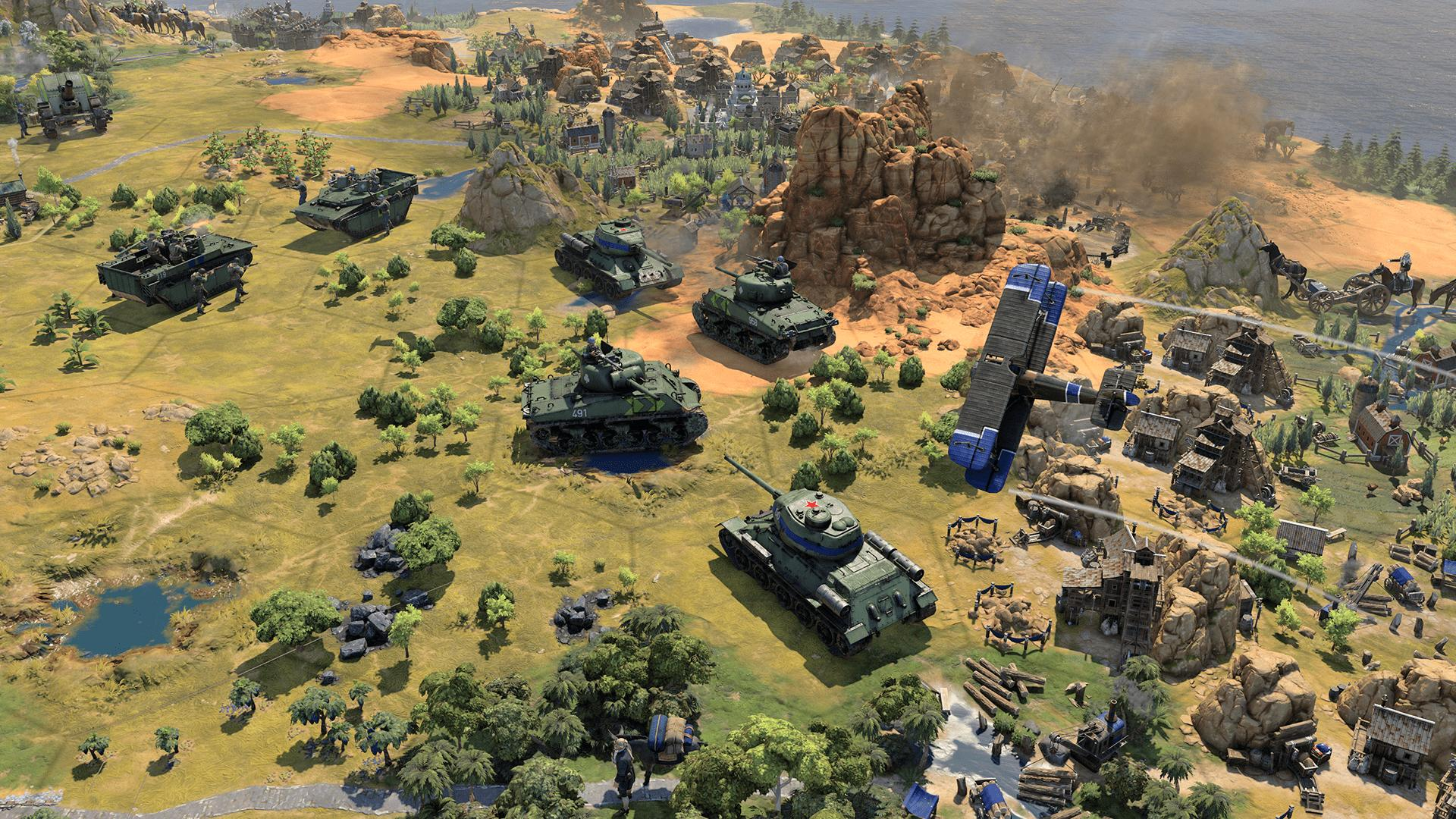 Eine Spielszene mit Panzern, Gebäuden und einem Feld.