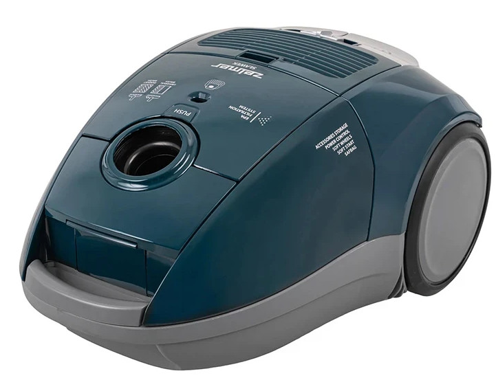 Turkusowy odkurzacz o zakrzywionej konstrukcji, z przyciskiem 'PUSH' i etykietami produktu.