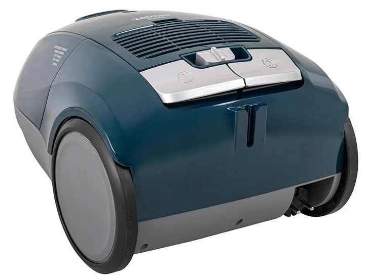 Widok z tyłu turkusowego odkurzacza, ukazujący konstrukcję i rozmieszczenie elementów.