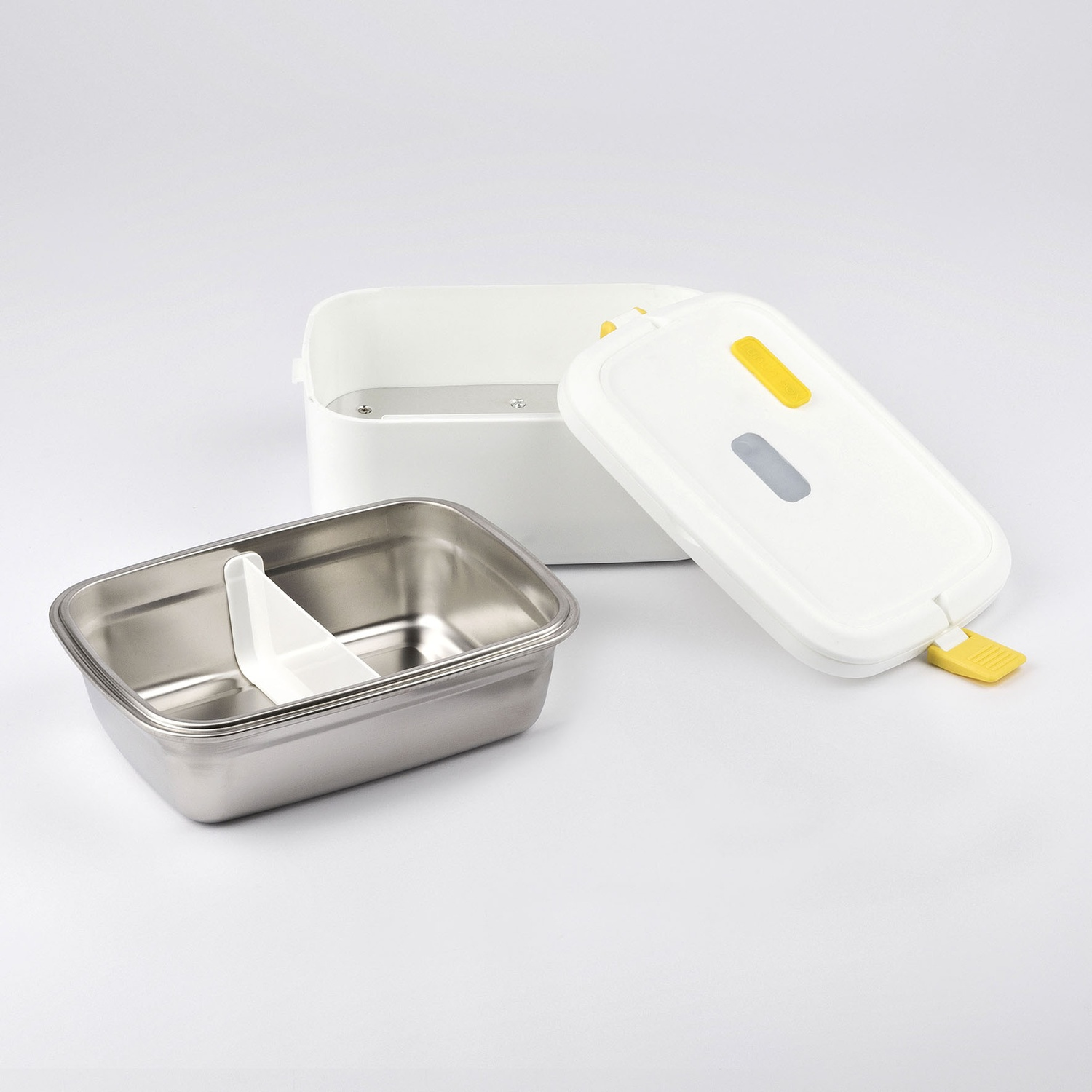 Lunch box bianco con coperchio aperto che mostra l'interno in acciaio inossidabile.