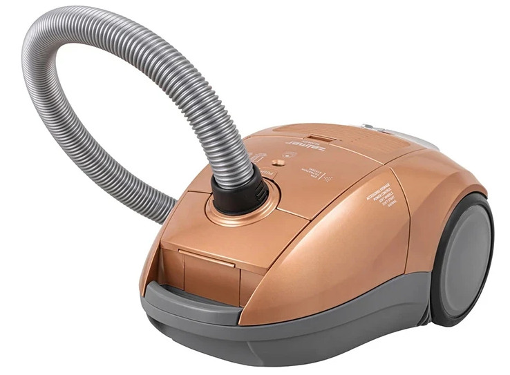 Złoty odkurzacz, widok z boku. Ma szarą podstawę, koła i przyłącze węża.