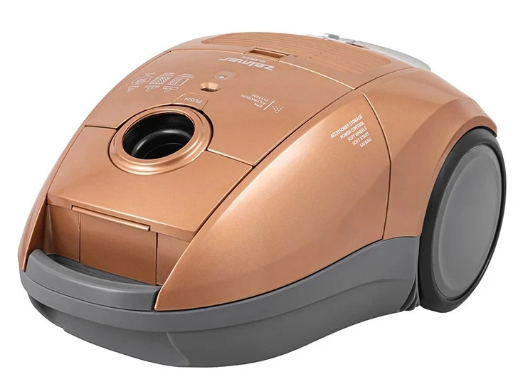 Złoty odkurzacz, widok pod kątem. Pokazuje górę, przód i boki ze szczegółami oraz etykietami.