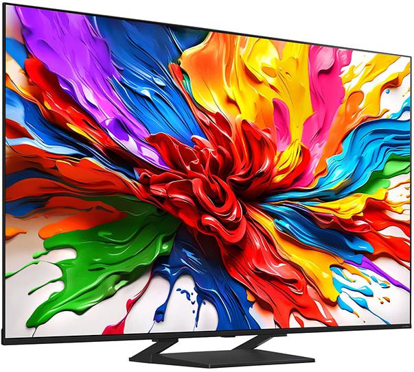 A TV egy színes, absztrakt képet jelenít meg. Fekete kerete és állványa van. A kép élénk színek keveréke.
