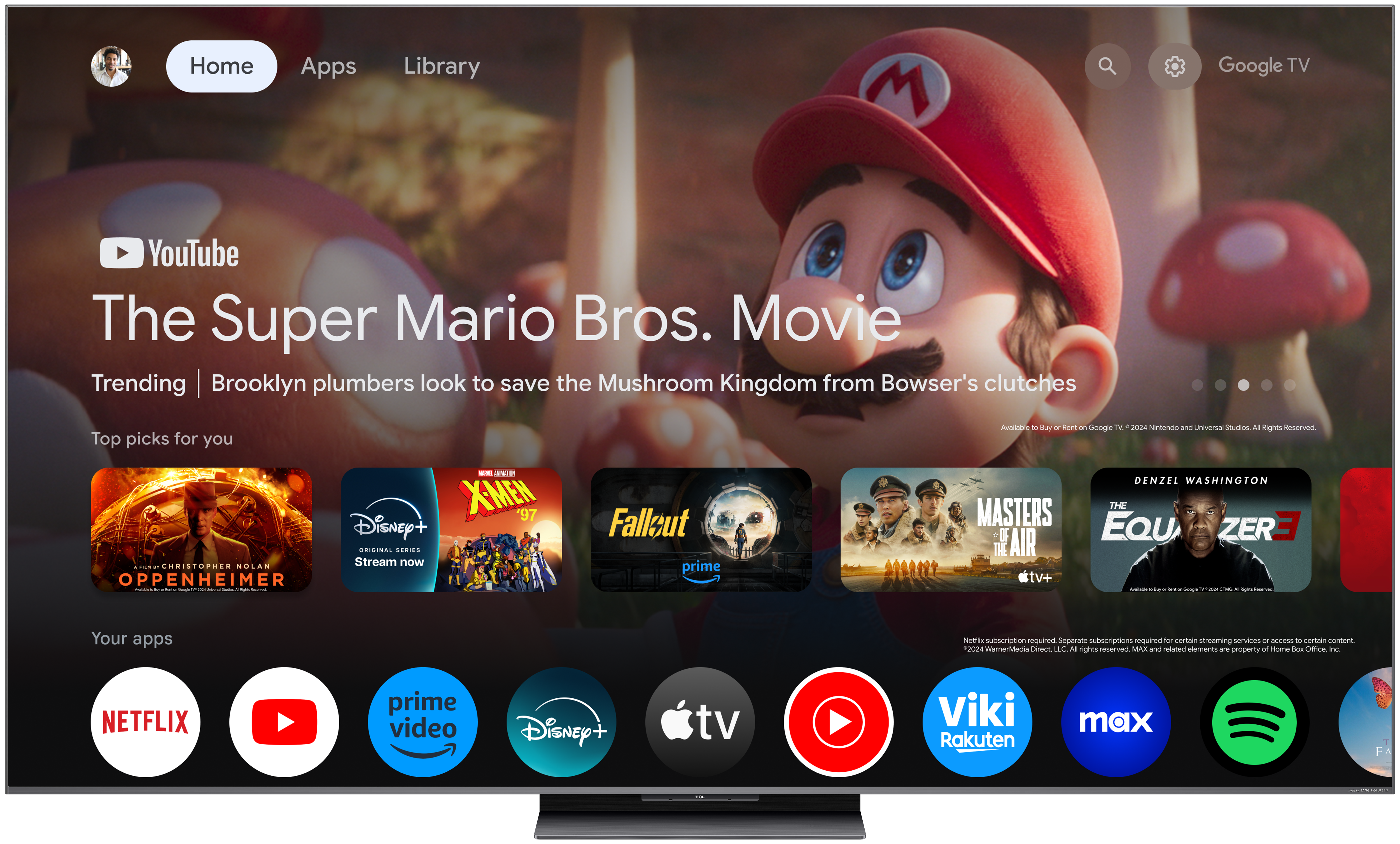 Ein Fernsehbildschirm zeigt 'The Super Mario Bros. Movie' mit Mario. Apps wie Netflix, YouTube und Disney+ werden angezeigt.