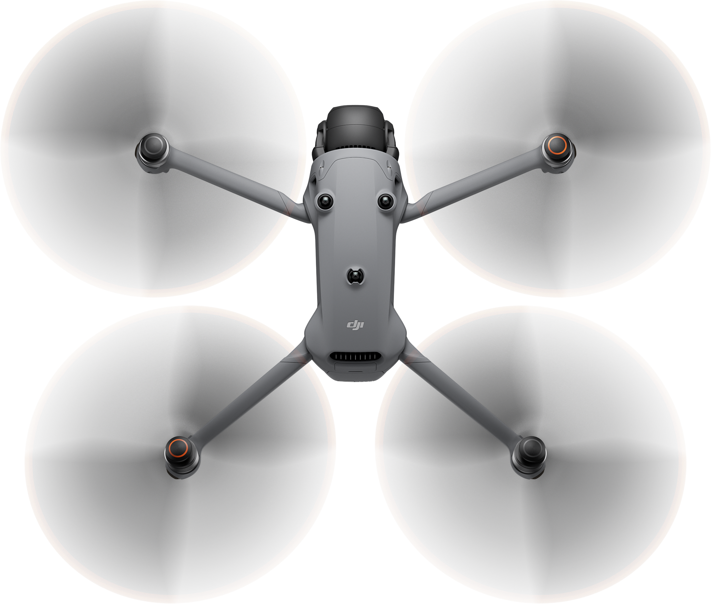 Graue Drohne. Propeller sind verschwommen. Schwarzer Hintergrund. Draufsicht.