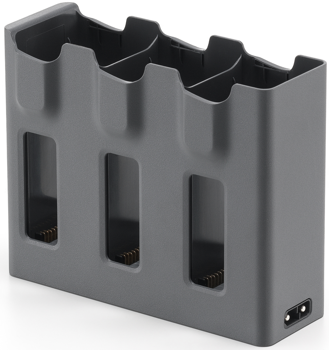 Hub de charge gris avec trois emplacements, fond noir, trois trous rectangulaires visibles.
