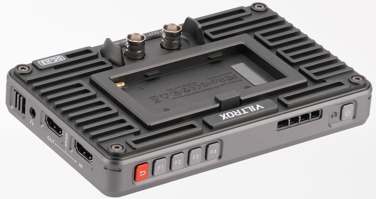 Un appareil Viltrox gris avec boutons et ports, un design métallique et un support de batterie. Il a un bouton d'alimentation.