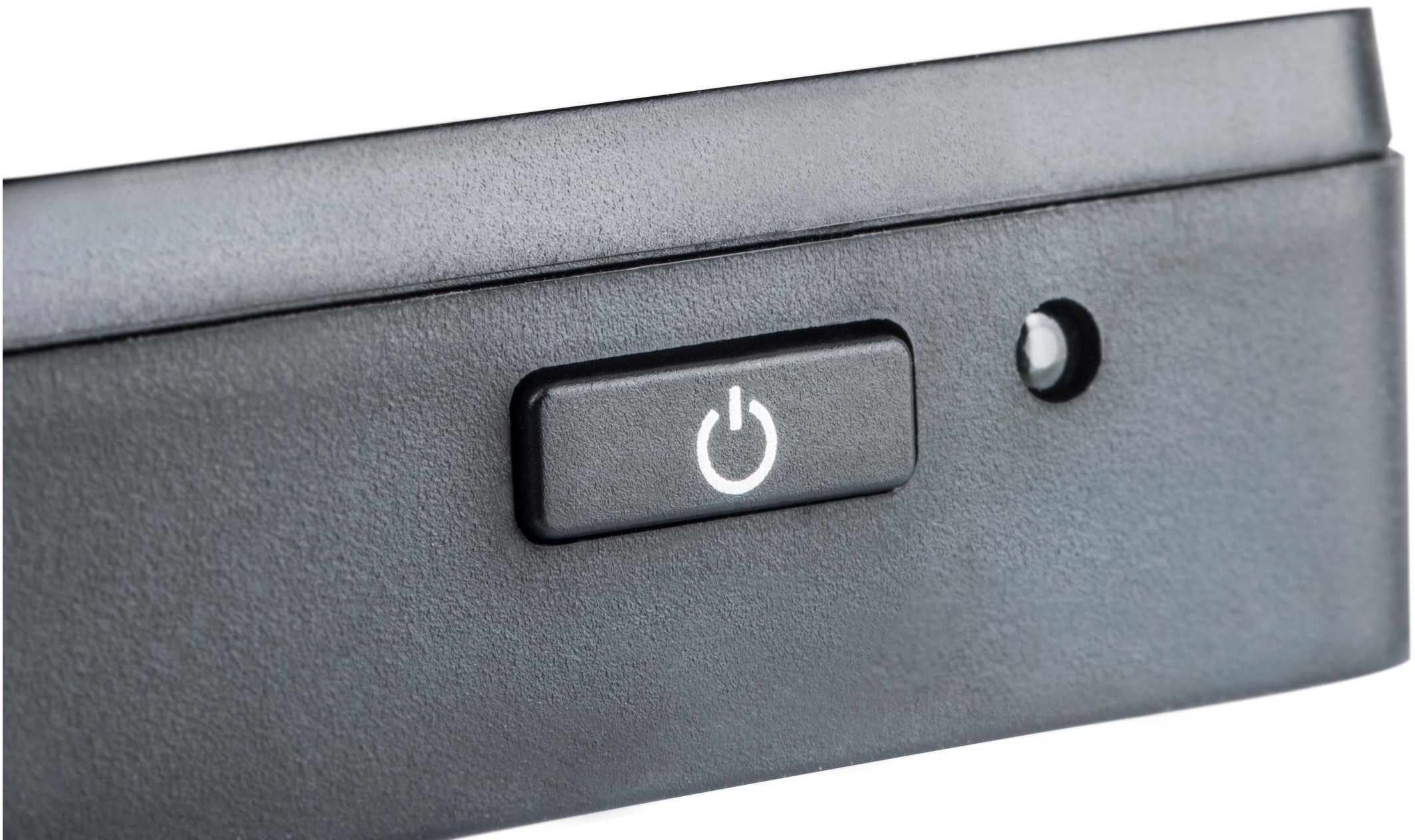 Bouton d'alimentation sur un moniteur noir. Le bouton a un symbole d'alimentation blanc.
