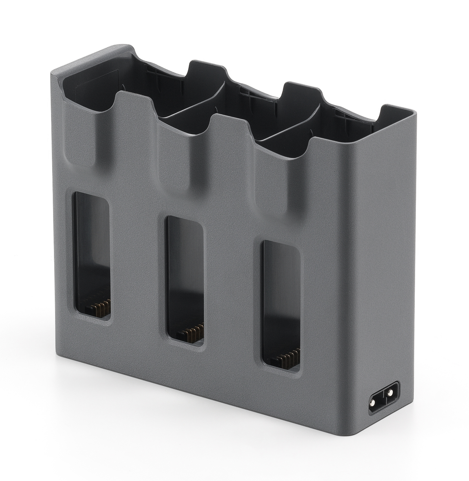 Szary hub ładujący z trzema gniazdami, widok z góry na białym tle, z portem ładowania.