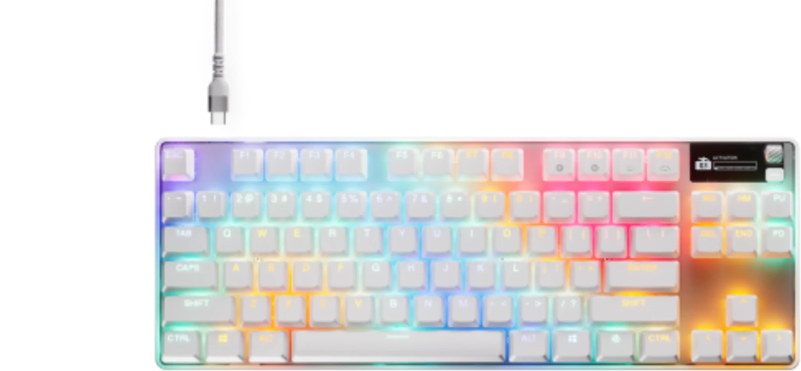 Fehér billentyűzet szivárványszínű gombvilágítással, USB-kábellel.