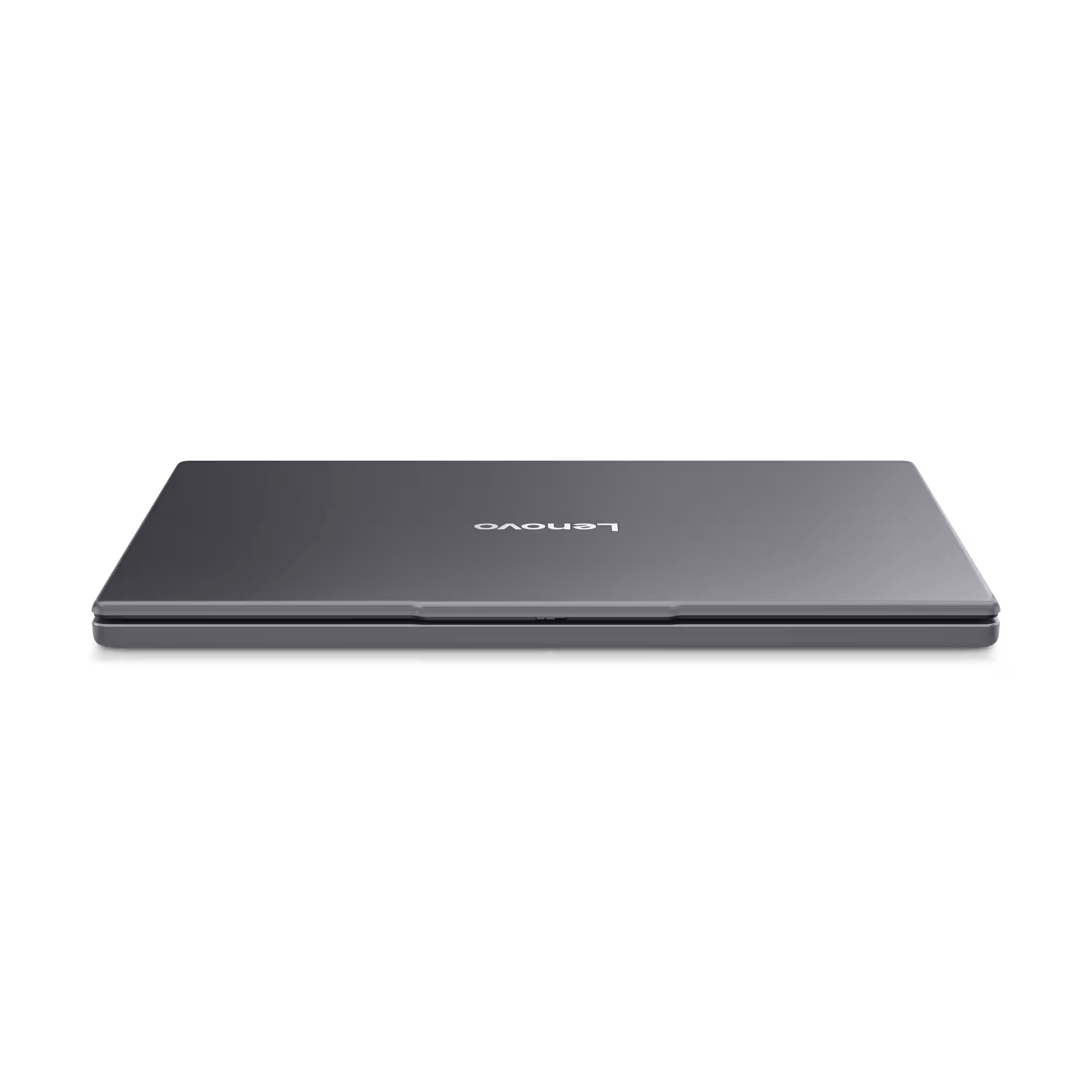 Un portátil Lenovo gris cerrado sobre un fondo negro. El logotipo de Lenovo es visible.