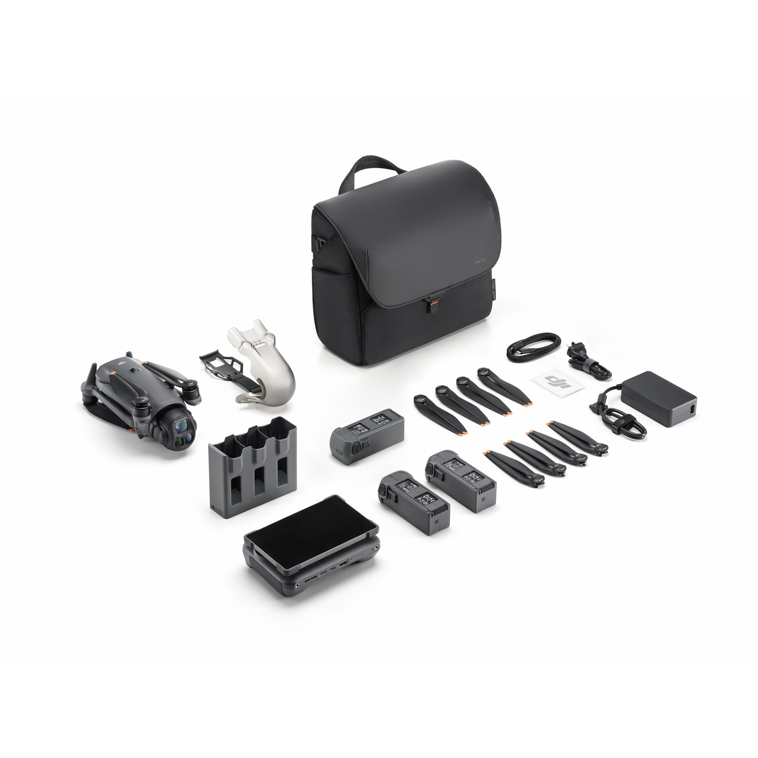 Kit drone con drone, batterie, caricabatterie, borsa e accessori su una superficie bianca.
