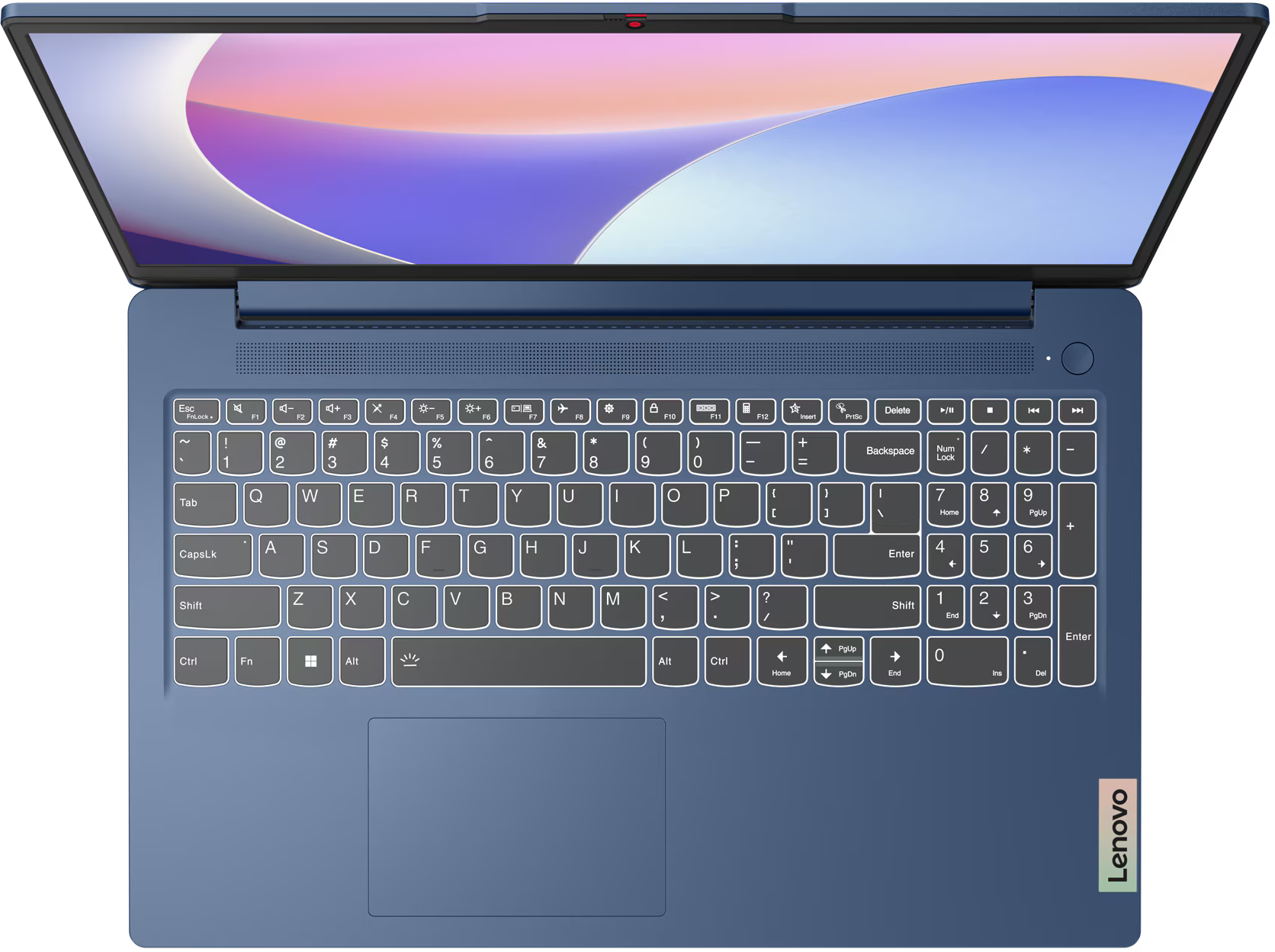 Egy nyitott kék laptop egy sötét felületen. A billentyűzet és a touchpad látható.
