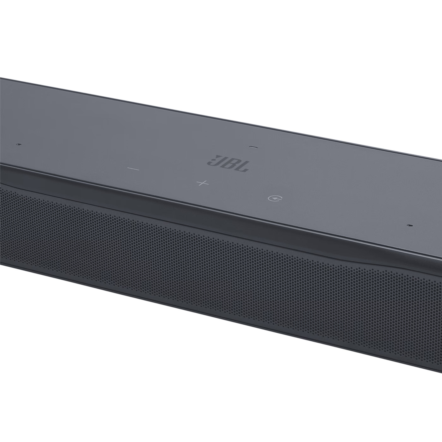Gros plan sur une barre de son. Le logo JBL est visible.