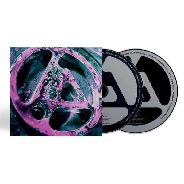 Albumcover eines CD-Cases und zwei CDs. Das Cover hat ein kreisförmiges Design mit lila und blauen Farbtönen.