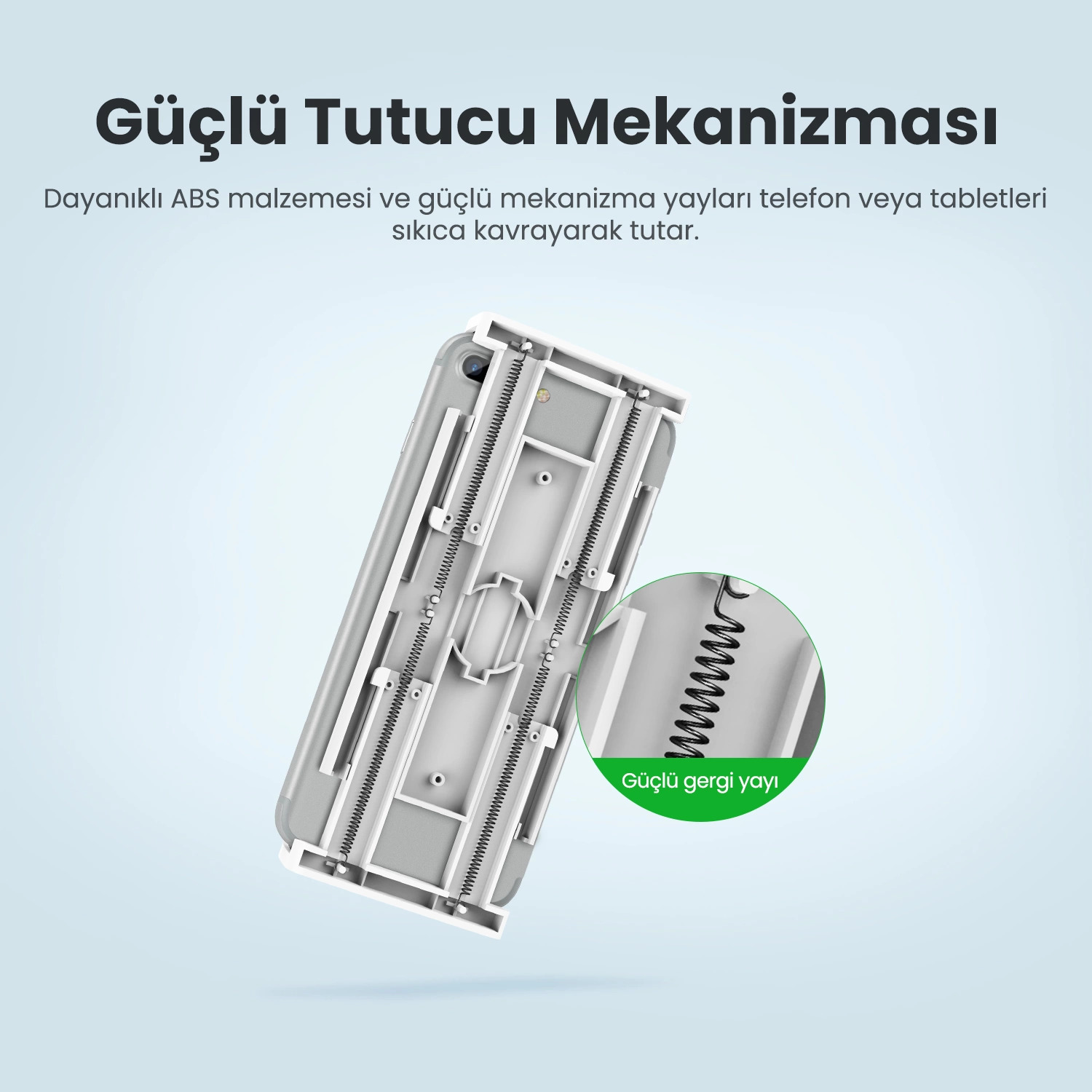 Yay mekanizmalı beyaz tablet tutucu. Yayın yakın çekimi de gösteriliyor.