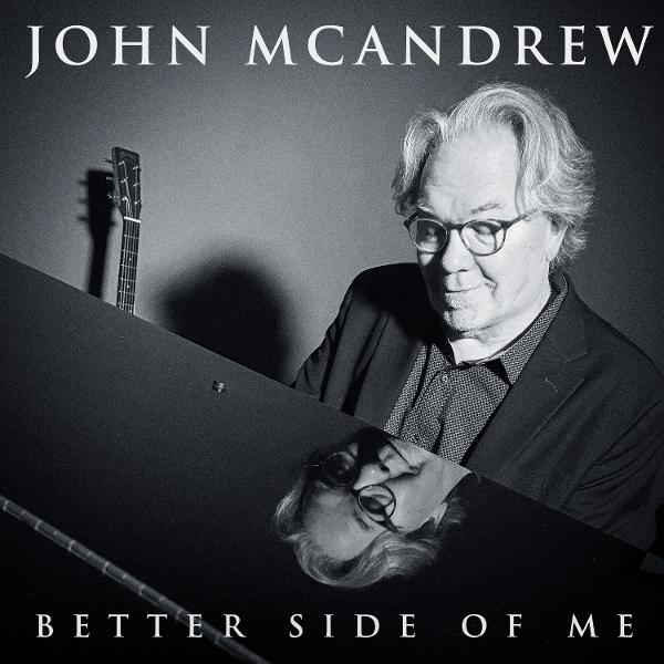 John McAndrew Albumcover: Mann mit Brille, der ein Klavier betrachtet, Spiegelung sichtbar.