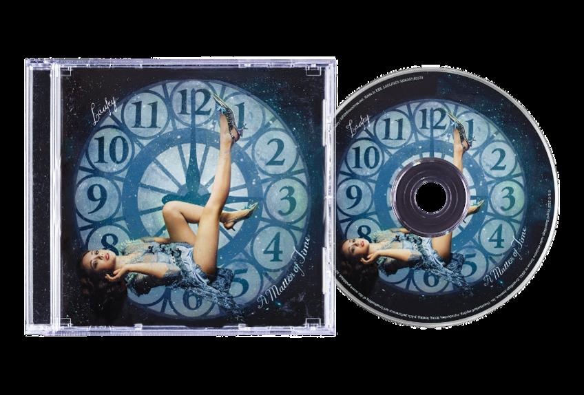 CD-Hülle und -Disc mit Frau vor Uhrhintergrund, Albumtitel 'A Matter of Time'.
