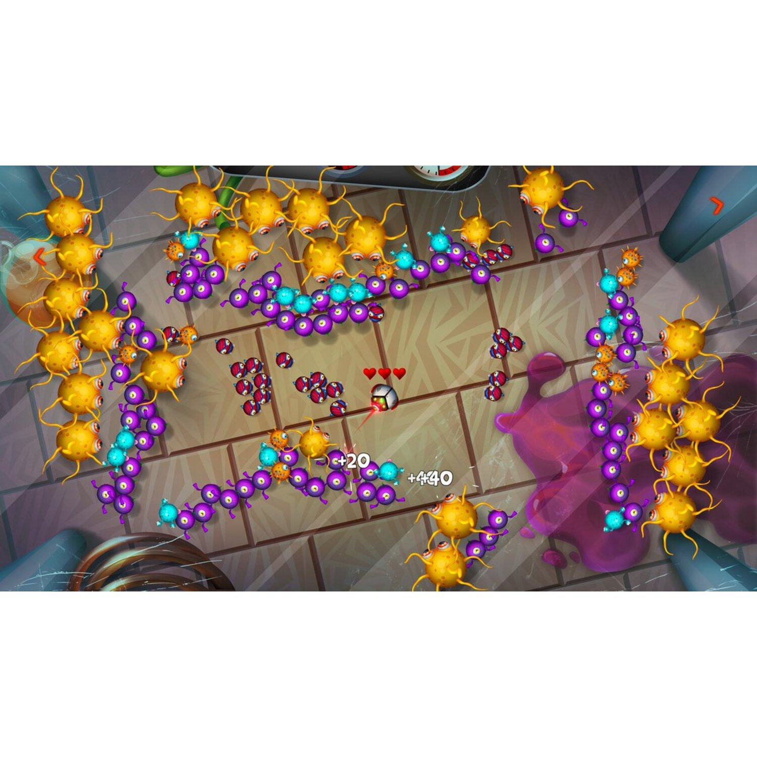 Écran de jeu : De nombreuses taches colorées attaquent un cube blanc. Coeurs au-dessus, chiffres indiquant le score.