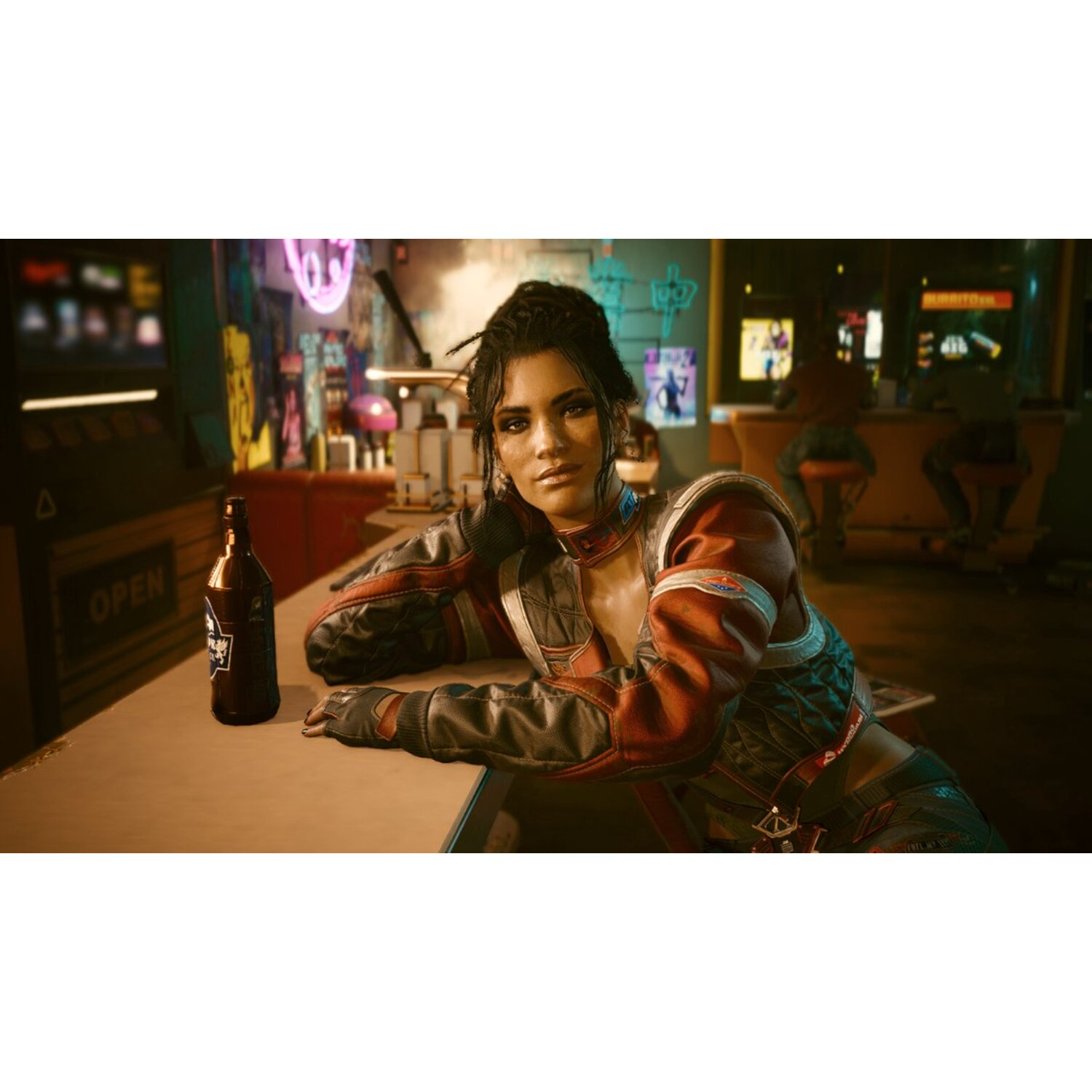 A woman sitting at a bar, looking at the camera. A beer bottle is on the bar.
