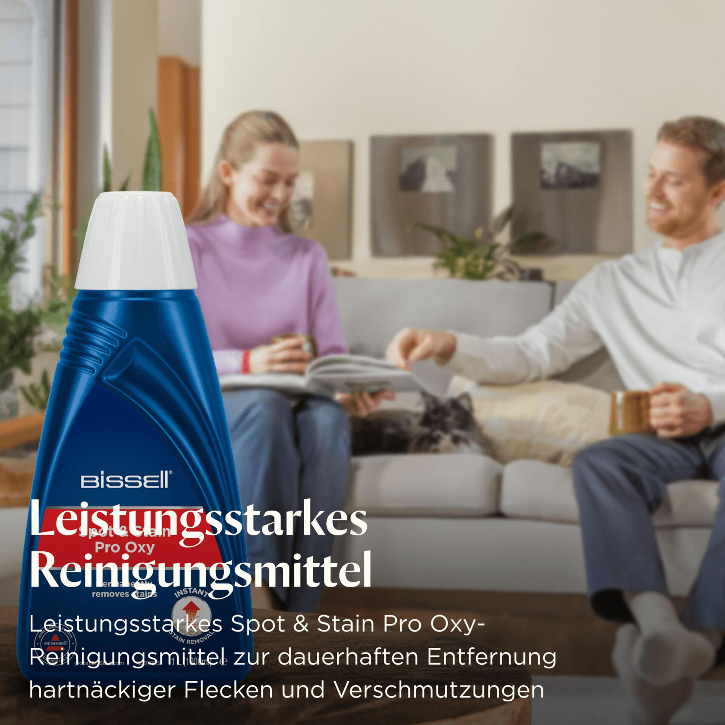 Ein blauer tragbarer Reiniger mit Schlauch und Reinigungskopf.