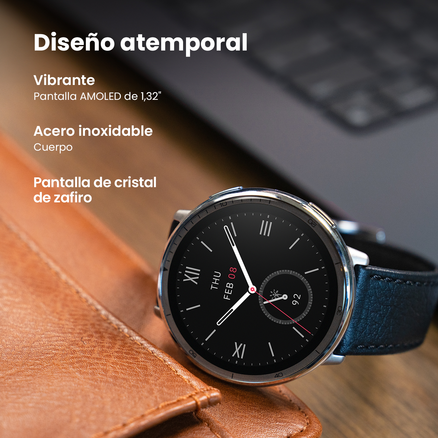 Smartwatch sobre una superficie de cuero. Texto: "Diseño atemporal", "Vibrante", "Cuerpo de acero inoxidable".