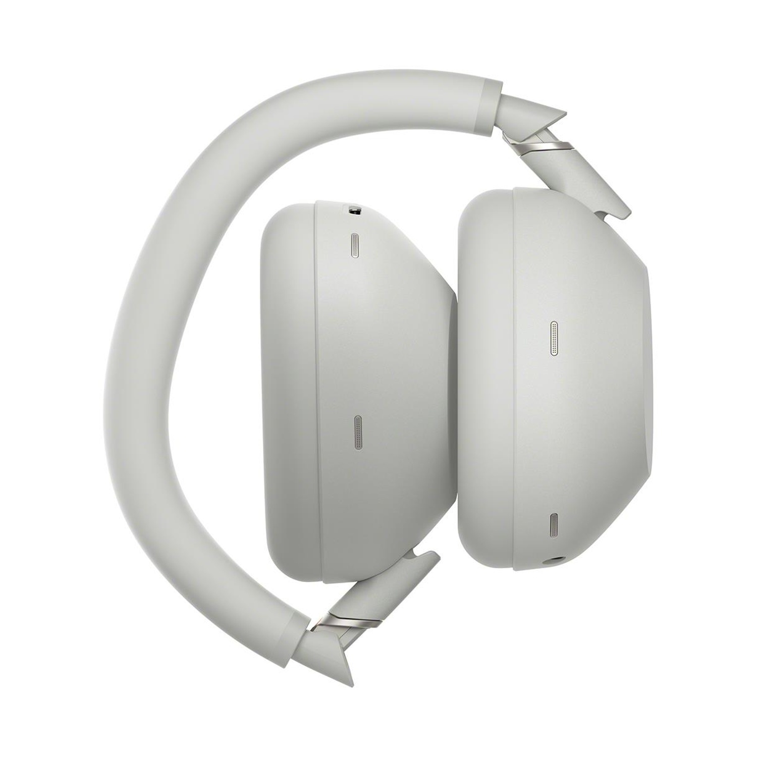 Cuffie Sony grigie piegate. Vista laterale, padiglioni e archetto visibili, sfondo bianco.