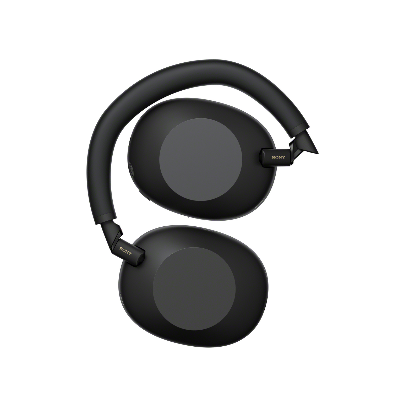 Auriculares Sony negros, plegados. Los auriculares son ovales. La diadema es curva. El fondo es blanco.