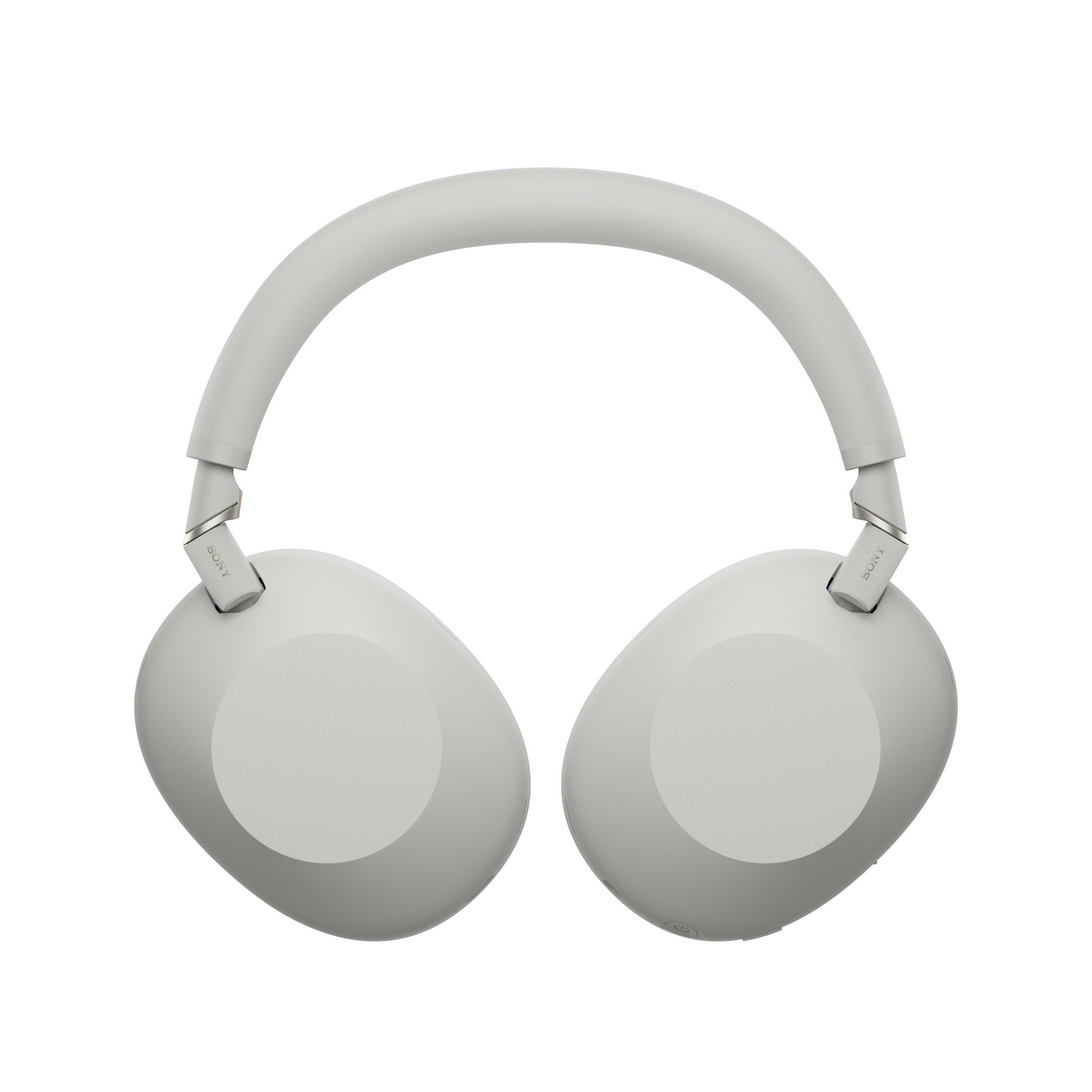 Vista frontal de auriculares Sony gris claro. Copas y diadema visibles. Fondo blanco.