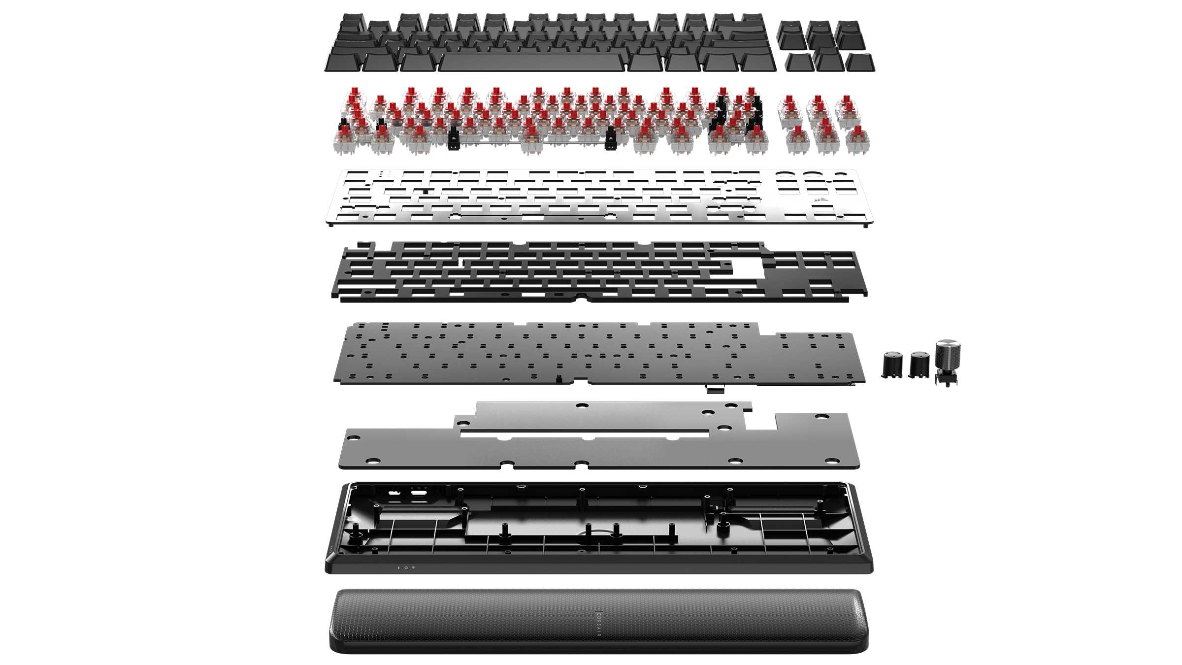 Explosionsansicht einer Tastatur, die Schichten von Komponenten zeigt: Tasten, Schalter, Rahmen und Handballenauflage.