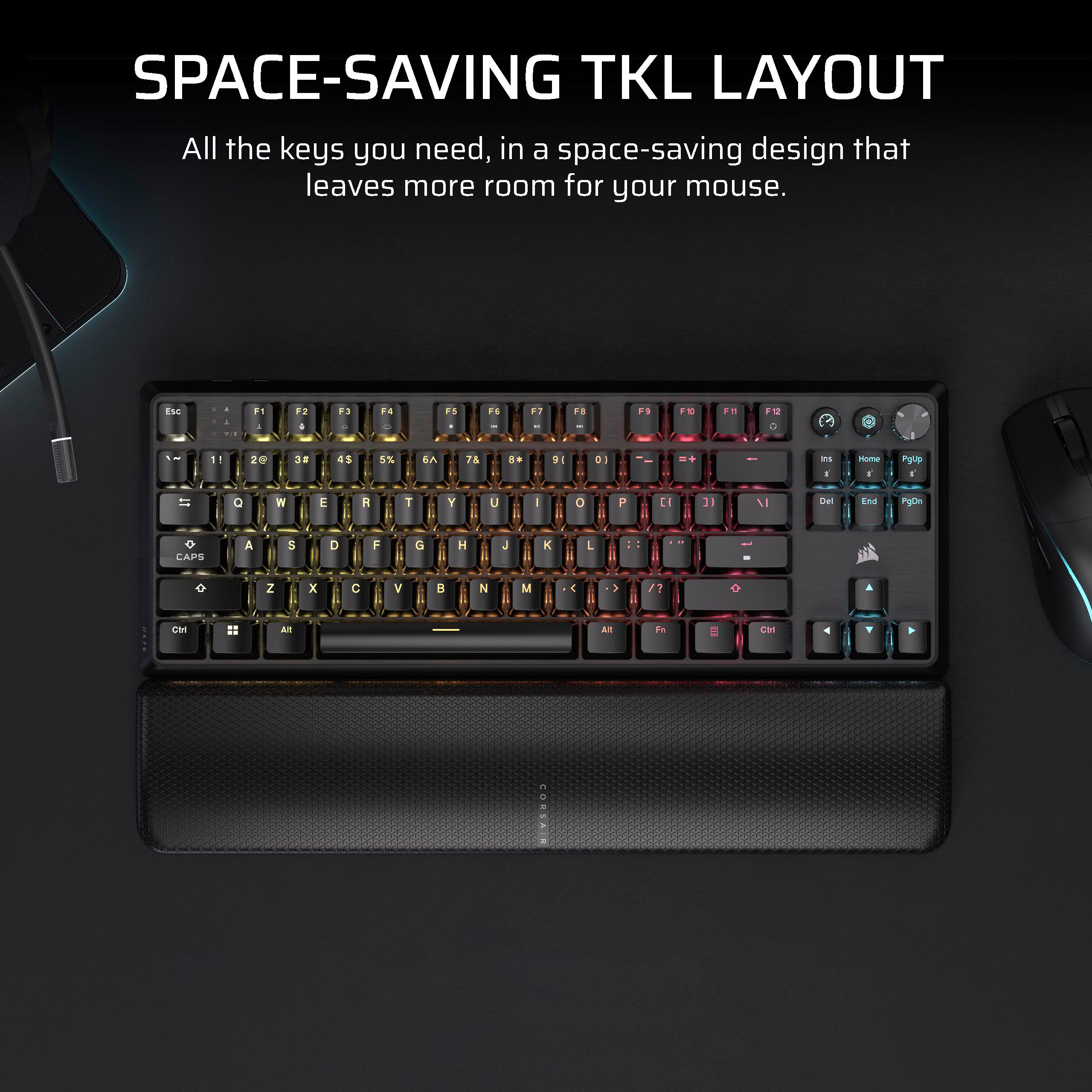 Schwarze Tastatur mit RGB-Hintergrundbeleuchtung und Handballenauflage. Der Text lautet 'Space-Saving TKL Layout'.