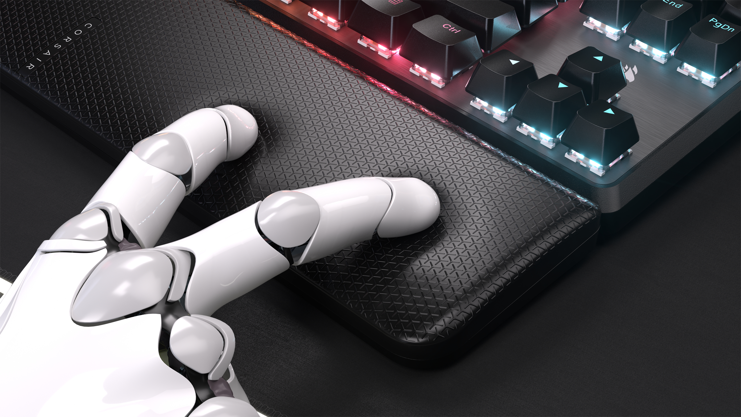 Ein Roboterhand ruht auf einer schwarzen Handballenauflage. Die Tastatur ist beleuchtet.