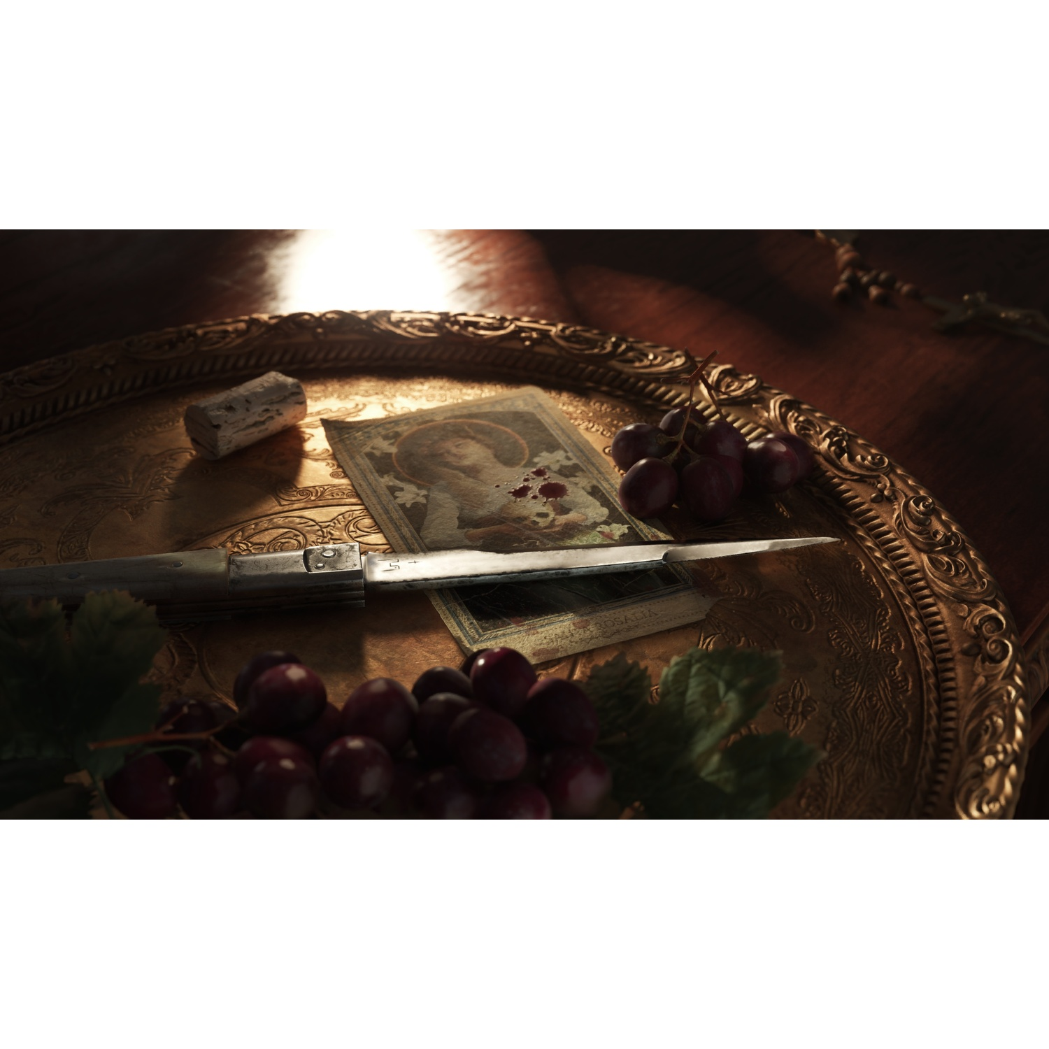 Knife, grapes, and a picture on a tray.