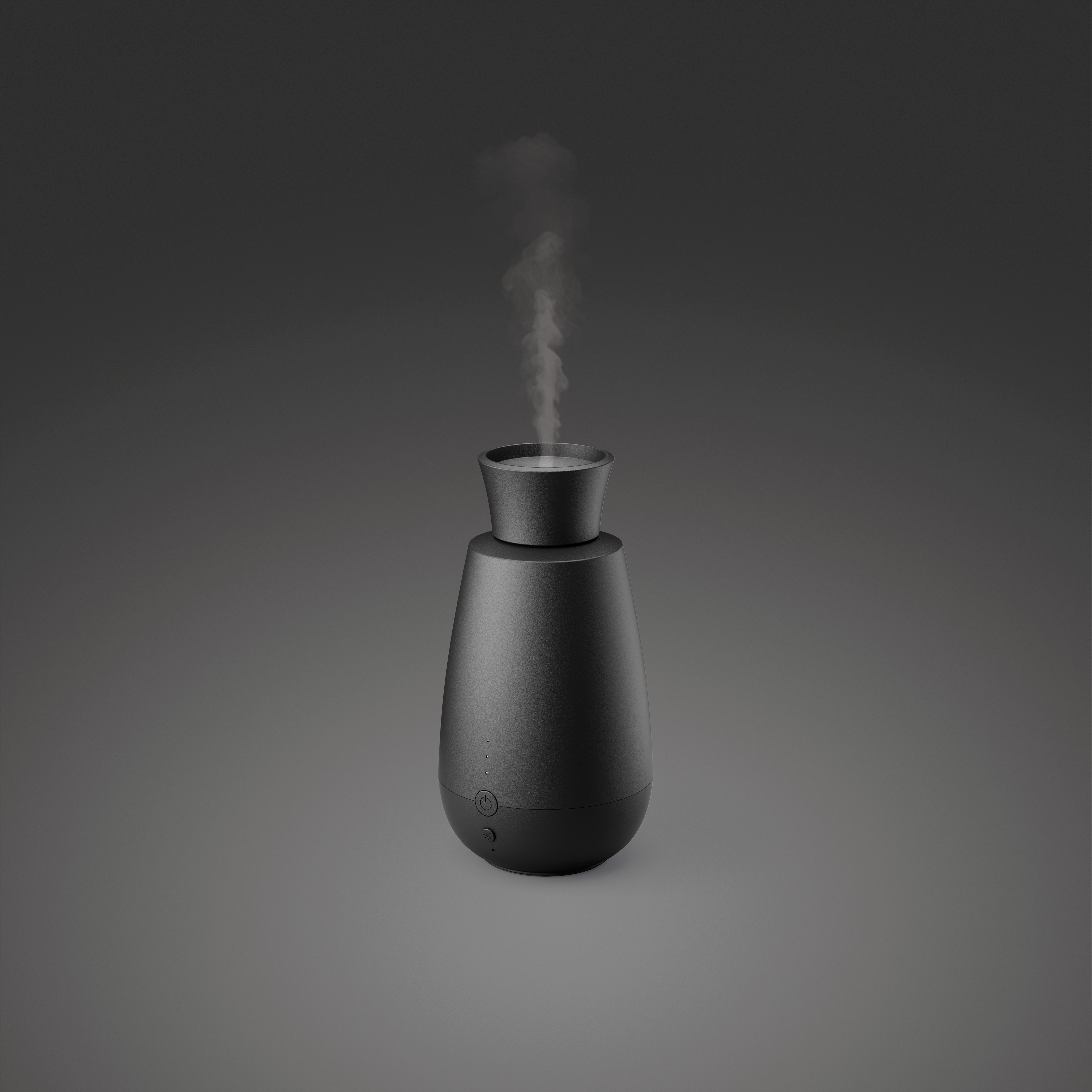 Schwarzer Aroma-Diffusor, der Dampf ausstößt, vor grauem Hintergrund. Minimalistisches Design.