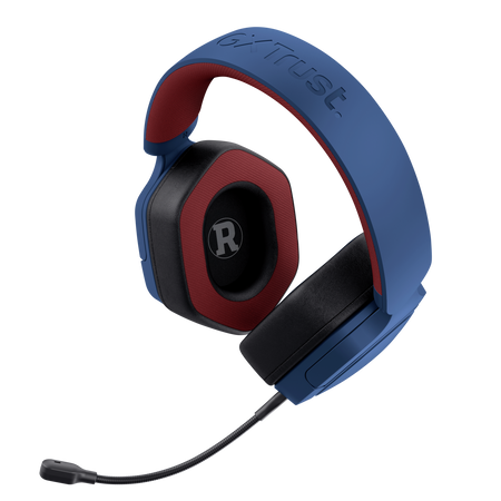 Niebiesko-czerwone słuchawki, marka Trust, widok z boku, czarne tło.