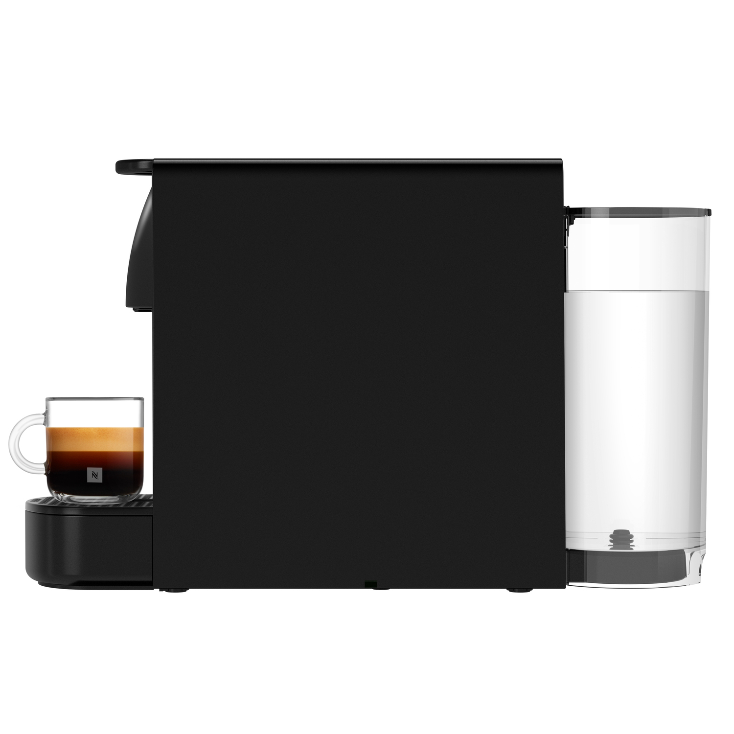 Black Nespresso machine from the side. A glass mug with coffee is under the spout.