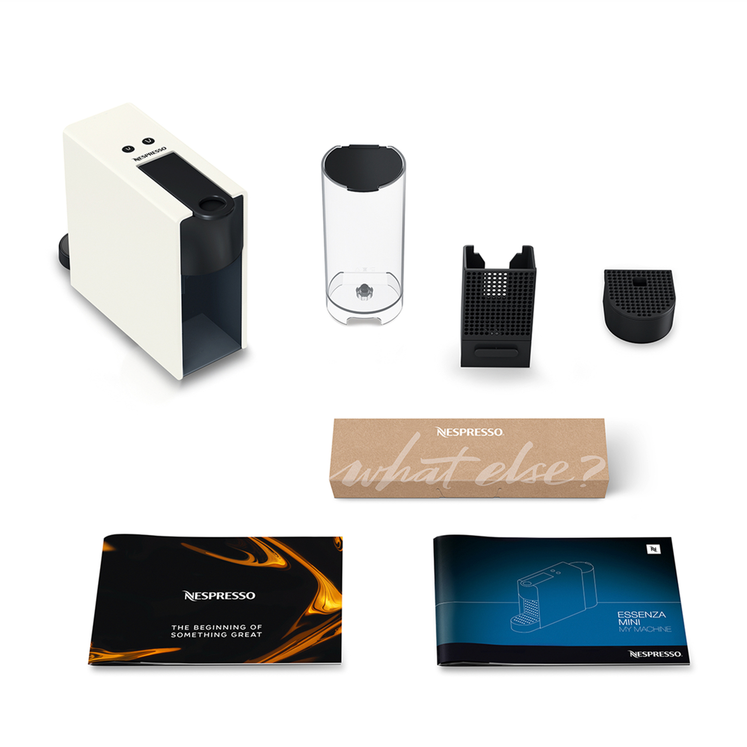 Coffee machine with components and manuals. The text: what else?