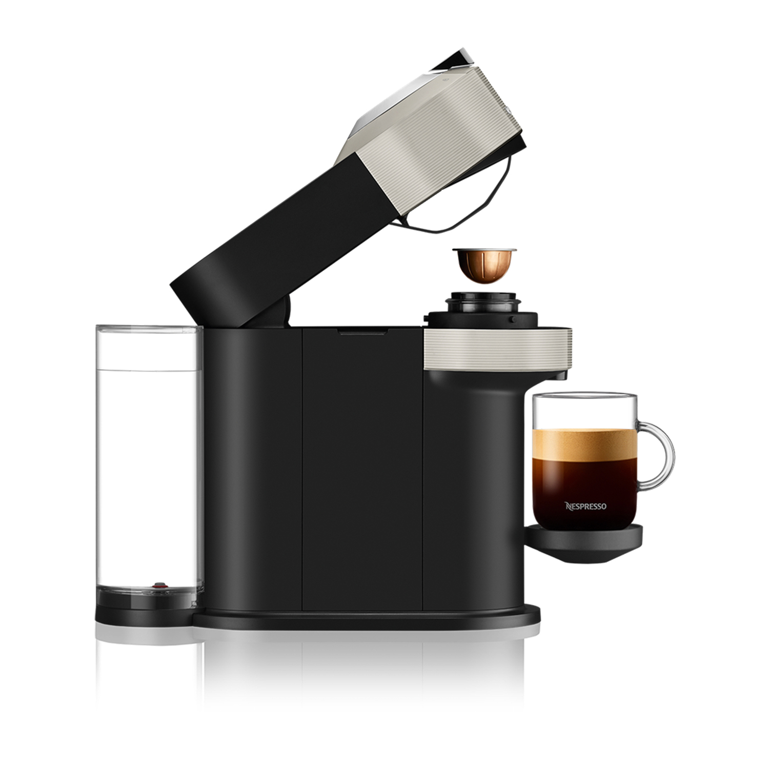 Nespresso Vertuo machine with an open top, capsule loading, and coffee in a cup.