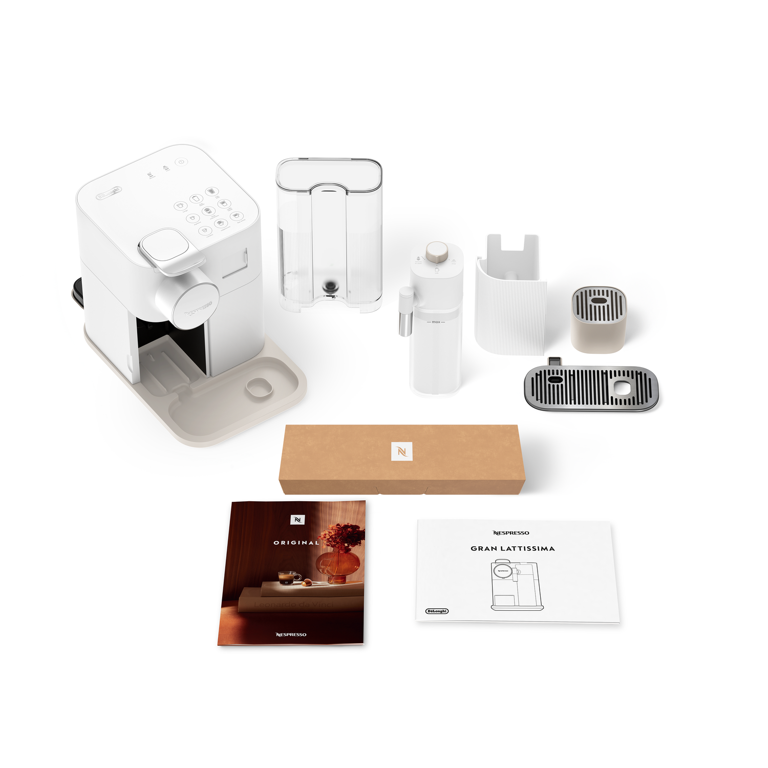 White Nespresso machine with accessories. Includes water tank, milk frother, and coffee pods on a white surface.