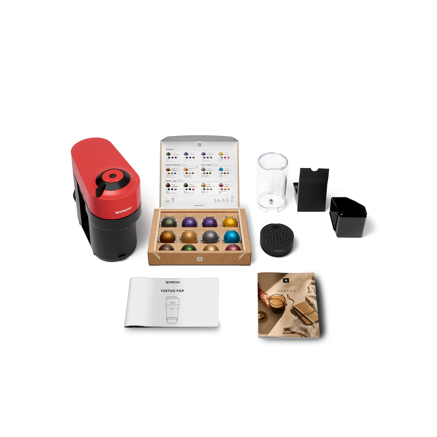 A red and black Nespresso machine with coffee capsules, accessories, and a coffee box.