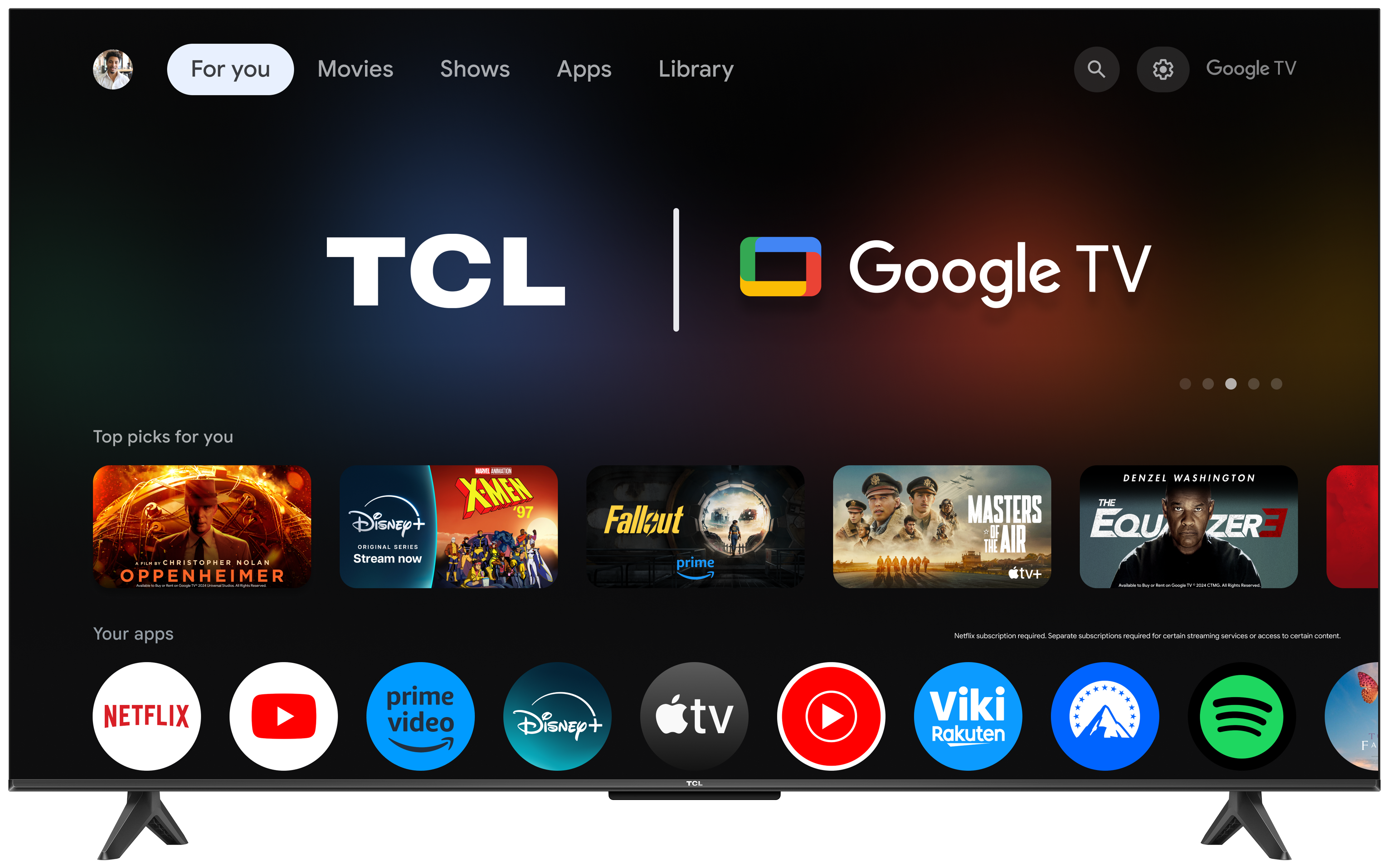 Ekran TCL Google TV. Ekran główny z ikonami aplikacji i rekomendacjami filmów.