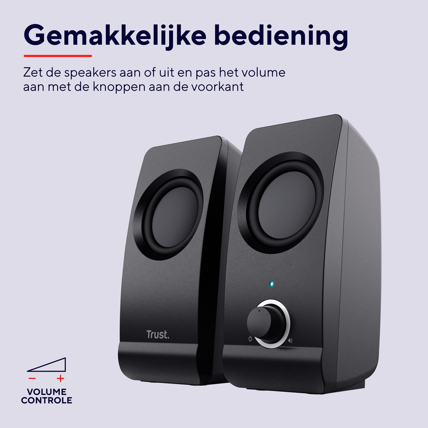 Two black speakers. One has a volume knob with a blue light.