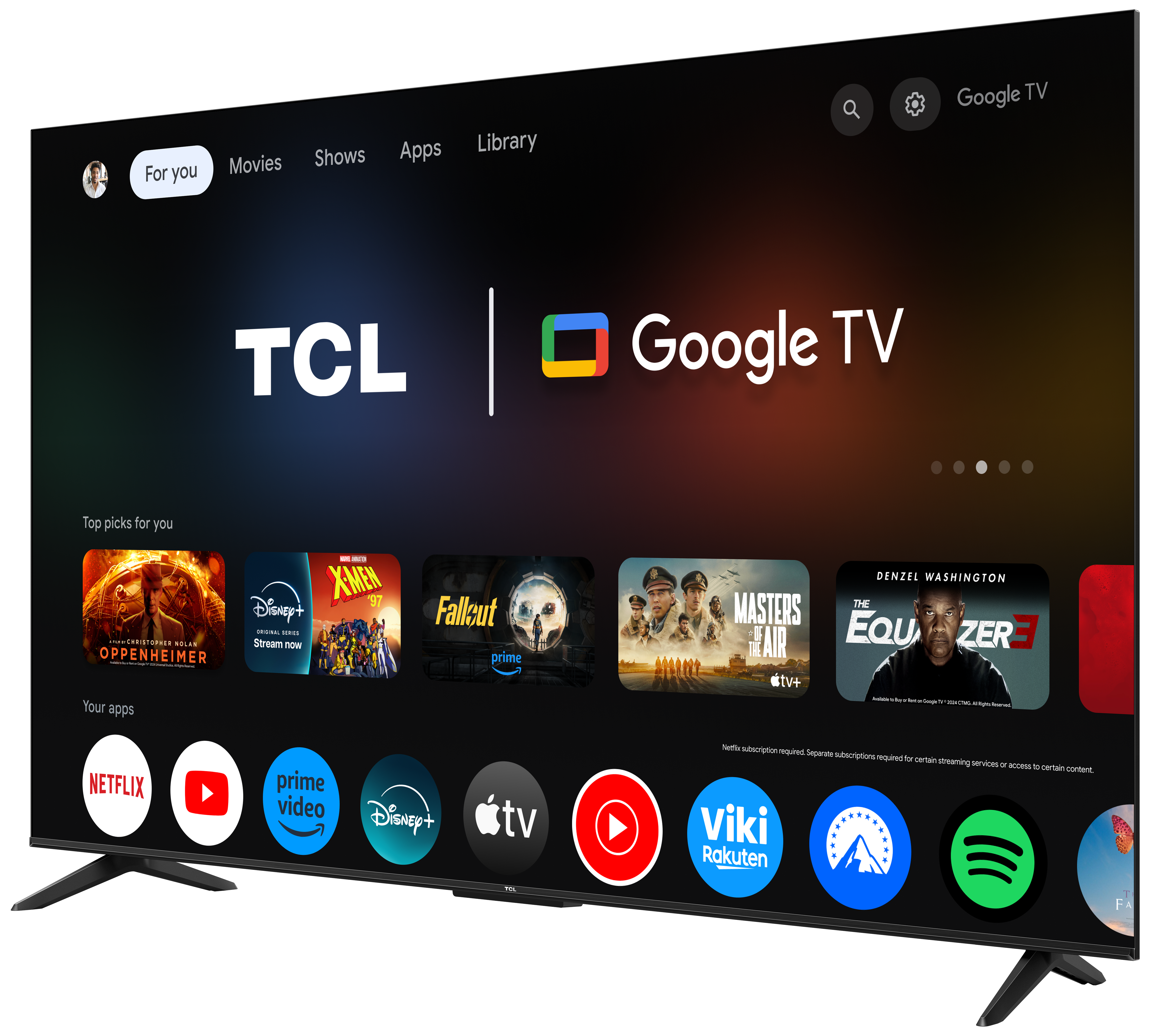 TCL Google TV z aplikacjami i filmami na ekranie, lekko przechylony do widoku z boku.
