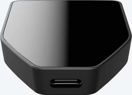 Appareil hexagonal noir avec une surface supérieure brillante et un port USB-C.