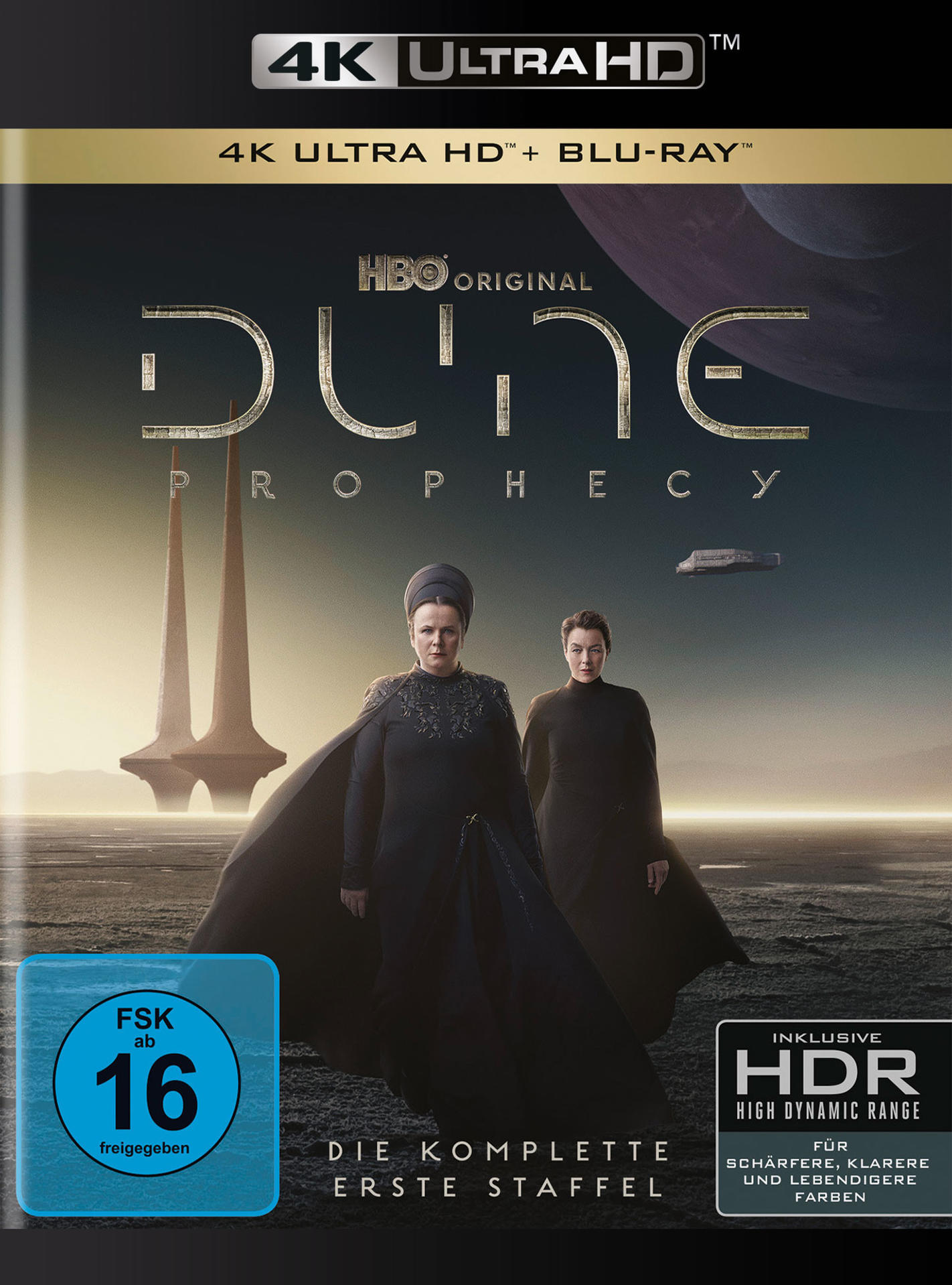 Dune: Prophecy Blu-ray-Cover mit zwei Personen in schwarzen Umhängen und Wüstenlandschaft.